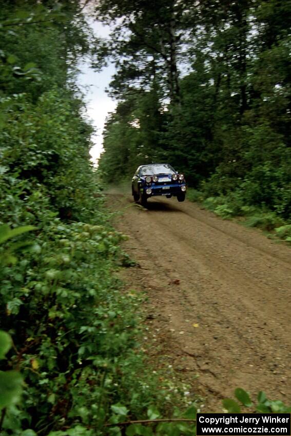 Mark Lovell / Steve Turvey Subaru WRX STi catches air at speed on SS2 (Stump Lake).