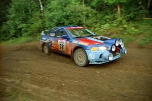 Alec Ellsworth / Steve Kaczkowski Mitsubishi Lancer Evo IV comes out of a 90-right on SS2 (Stump Lake).