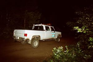 A sweep vehicle drives out of a 90-right on SS2 (Stump Lake).