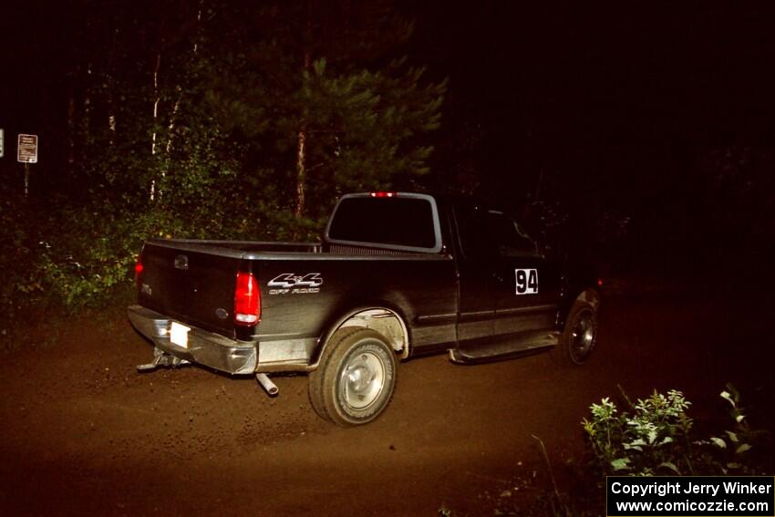 A sweep vehicle drives out of a 90-right on SS2 (Stump Lake).