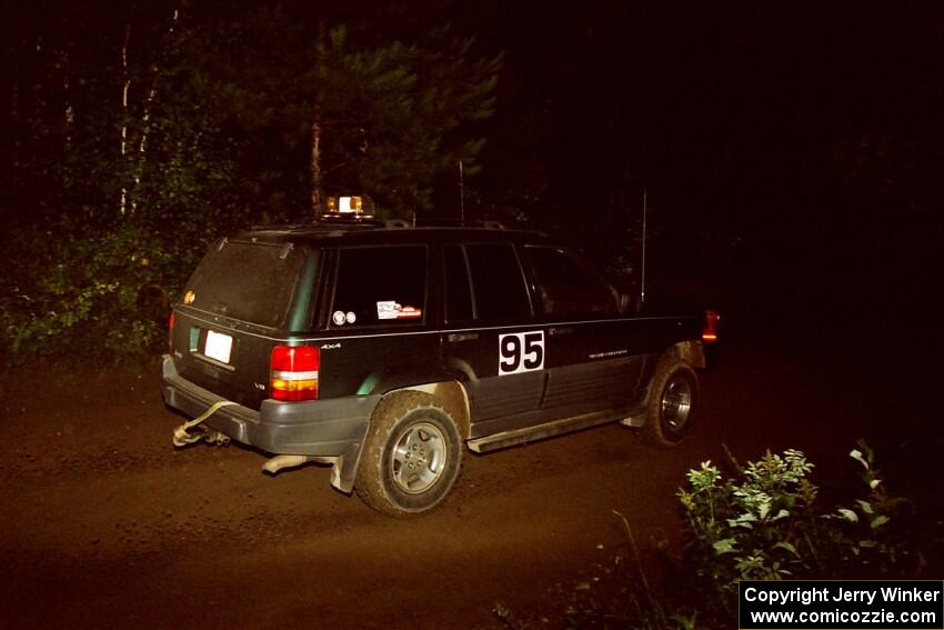 A sweep vehicle drives out of a 90-right on SS2 (Stump Lake).