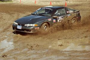 Paul Peters / Bob Anderson Mitsubishi Eclipse GSX slops through the mud on SS7 (Speedway Shenanigans).