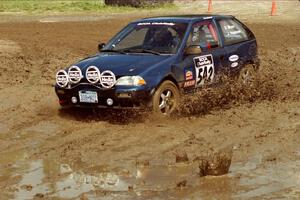 Dan Moore / John Hopponen Suzuki Swift GTi slops through the mud on SS7 (Speedway Shenanigans).