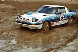 Doug Dill / Tyler Dill Mazda RX-7 slops through the mud on SS7 (Speedway Shenanigans).