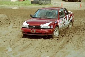 Eric Seppanen / Jake Himes Nissan Sentra SE-R slops through the mud on SS7 (Speedway Shenanigans).
