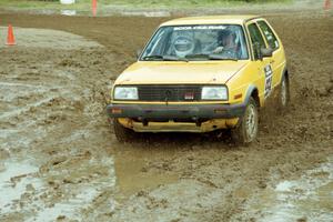 Mark Buskirk / Paul Fernandez VW GTI slops through the mud on SS7 (Speedway Shenanigans).