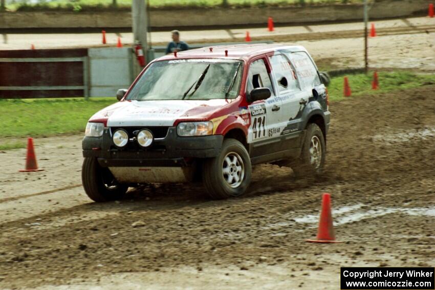 Greg Pachman / Ray Summers Ford Escape slops through the mud on SS7 (Speedway Shenanigans).
