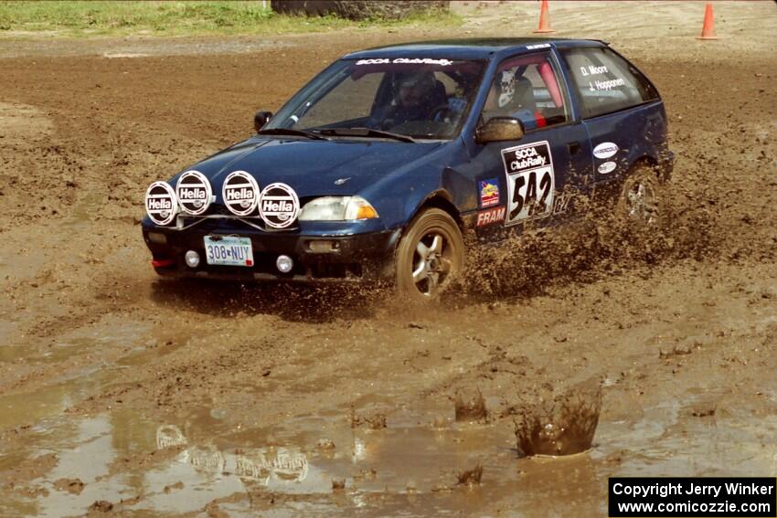 Dan Moore / John Hopponen Suzuki Swift GTi slops through the mud on SS7 (Speedway Shenanigans).