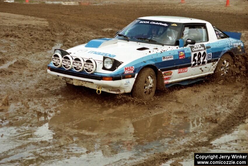 Doug Dill / Tyler Dill Mazda RX-7 slops through the mud on SS7 (Speedway Shenanigans).