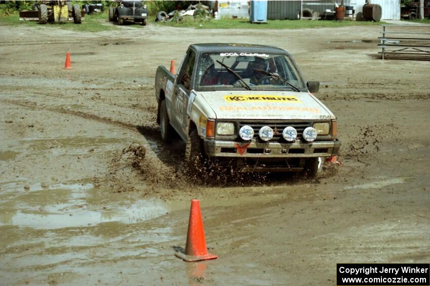 Bryan Ackerman / Sean Figgins Mitsubishi Mighty Max slops through the mud on SS7 (Speedway Shenanigans).