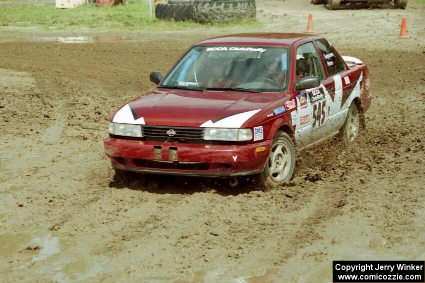 Eric Seppanen / Jake Himes Nissan Sentra SE-R slops through the mud on SS7 (Speedway Shenanigans).