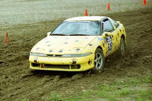 Rod Dean / Nichole Dean Plymouth Laser RS slops through the mud on SS7 (Speedway Shenanigans).