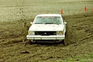 Jerry Brownell / Jim Windsor Chevy Citation X-11 slops through the mud on SS7 (Speedway Shenanigans).