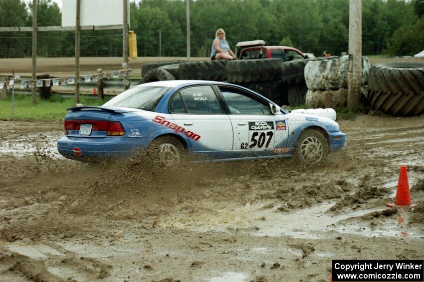 Micah Wiitala / Jared Kemp Saturn SL2 slops through the mud on SS7 (Speedway Shenanigans).