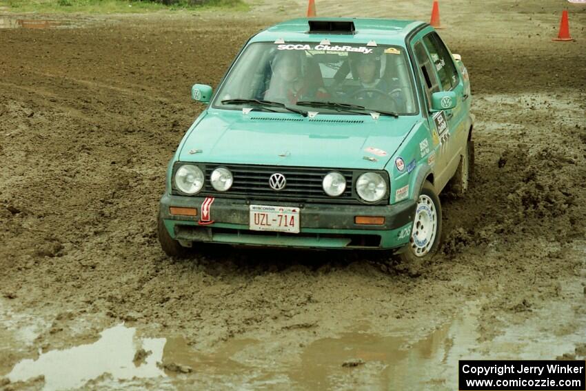 Larry Warrington / Damien Crane VW Jetta slops through the mud on SS7 (Speedway Shenanigans).