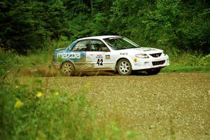 Eric Burmeister / Eric Adams Mazda Protege' MP3 at the spectator point on SS9 (The Spurs).