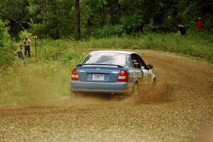 Eric Burmeister / Eric Adams Mazda Protege' MP3 at the spectator point on SS9 (The Spurs).