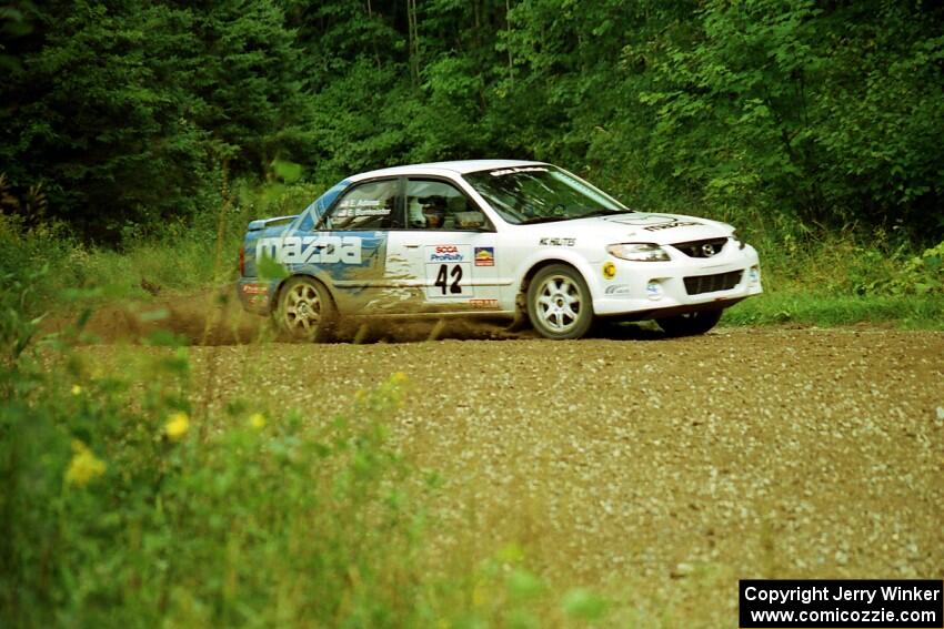 Eric Burmeister / Eric Adams Mazda Protege' MP3 at the spectator point on SS9 (The Spurs).