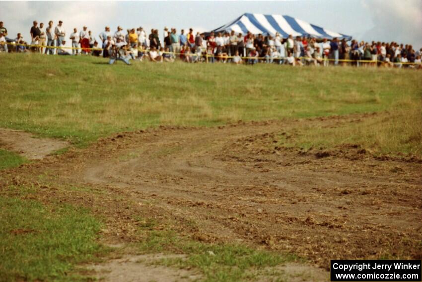 View of a sharp hairpin and the crowd on the hill on SS10 (NJK Ranch).