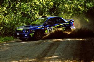 Mark Lovell / Steve Turvey Subaru WRX STi powers out of a sharp left-hander on SS13 (Steamboat).