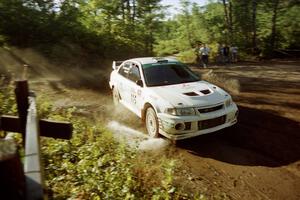 Seamus Burke / Frank Cunningham Mitsubishi Lancer Evo IV powers out of a sharp left-hander on SS13 (Steamboat).