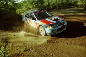 Alec Ellsworth / Steve Kaczkowski Mitsubishi Lancer Evo IV powers out of a sharp left-hander on SS13 (Steamboat).