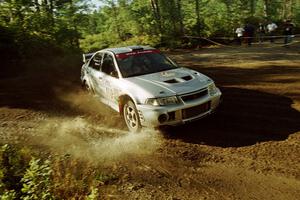 Mark Nelson / Alex Gelsomino Mitsubishi Lancer Evo VI powers out of a sharp left-hander on SS13 (Steamboat).