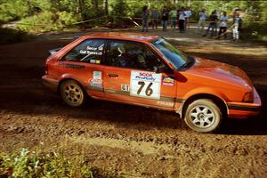 Gail Truess / Jeff Secor Mazda 323GTX powers out of a sharp left-hander on SS13 (Steamboat).