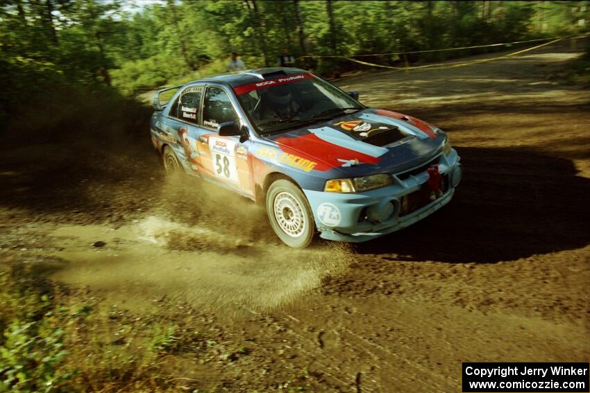 Alec Ellsworth / Steve Kaczkowski Mitsubishi Lancer Evo IV powers out of a sharp left-hander on SS13 (Steamboat).