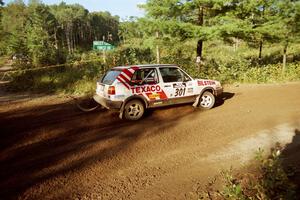 Tony Chavez / Doug Robinson VW GTI powers out of a sharp left-hander on SS13 (Steamboat).