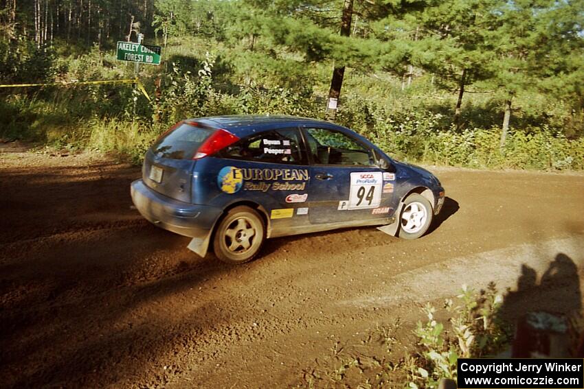 Craig Peeper / Ian Bevan Ford Focus powers out of a sharp left-hander on SS13 (Steamboat).