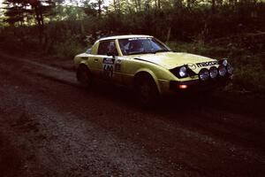 Scott Justus / Sumit Panjabi Mazda RX-7 at speed on SS13 (Steamboat).