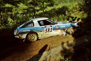 Doug Dill / Tyler Dill Mazda RX-7 at speed on SS13 (Steamboat).