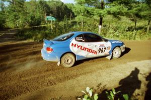 Dave Coleman / Paula Gibeault Hyundai Tiburon powers out of a sharp left-hander on SS13 (Steamboat).