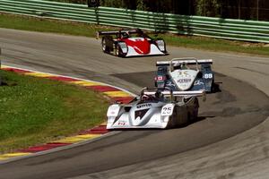 A trio of Lola B2K/40/Nissans battle on lap one.