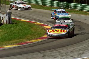 Four cars battle into Canada Corner.