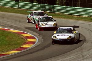 A trio of Porsche 996 GT3-Rs at Canada Corner.