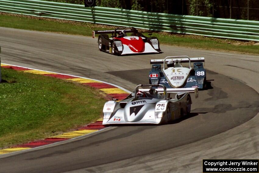 A trio of Lola B2K/40/Nissans battle on lap one.