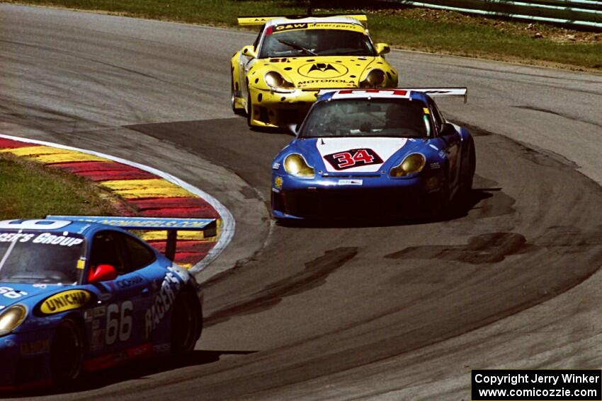 A trio of Porsche 996 GT3-Rs at Canada Corner.