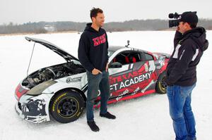 Josh Robinson is interviewed in front of his Nissan 350Z.