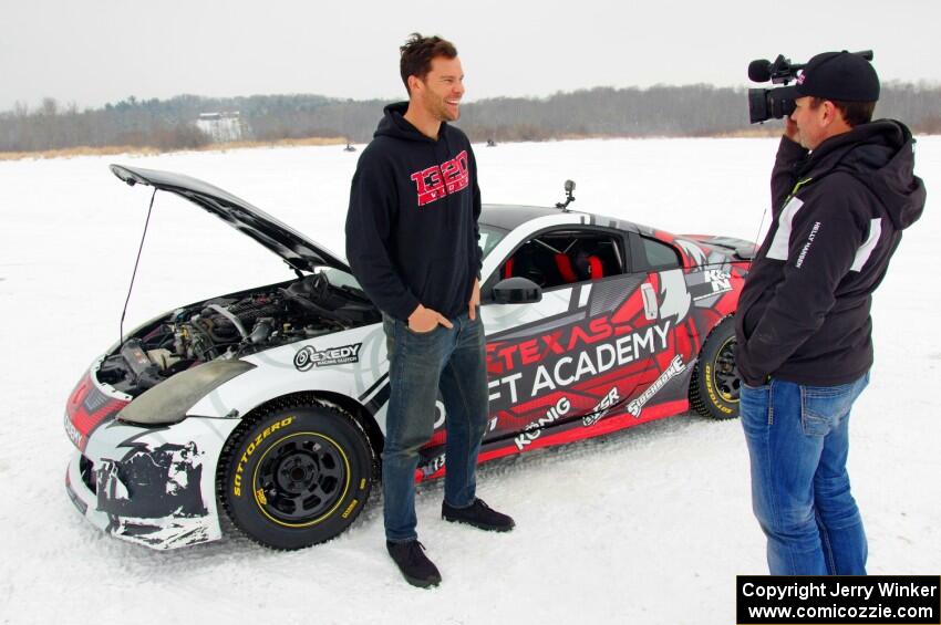 Josh Robinson is interviewed in front of his Nissan 350Z.