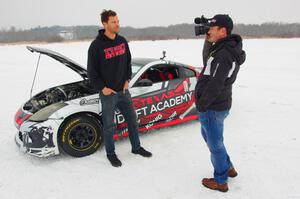 Josh Robinson is interviewed in front of his Nissan 350Z.