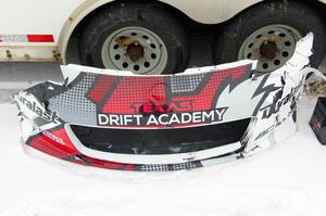 The front bumper of Brent ???'s Nissan 350Z in the paddock after contact.