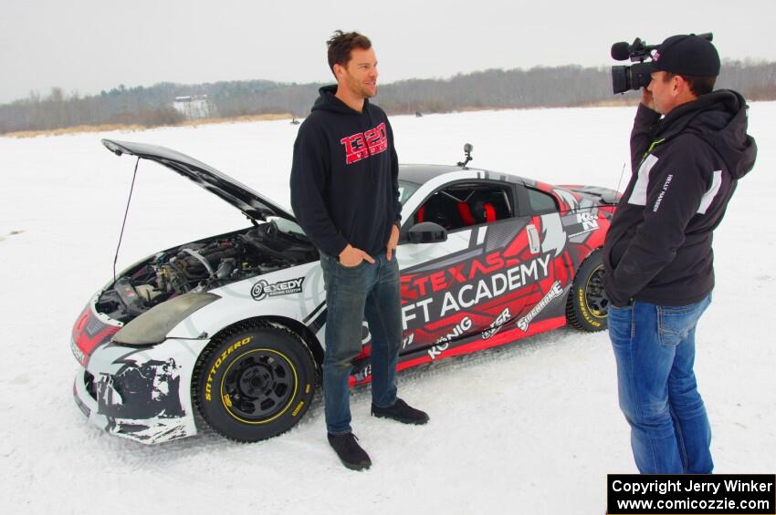 Josh Robinson is interviewed in front of his Nissan 350Z.