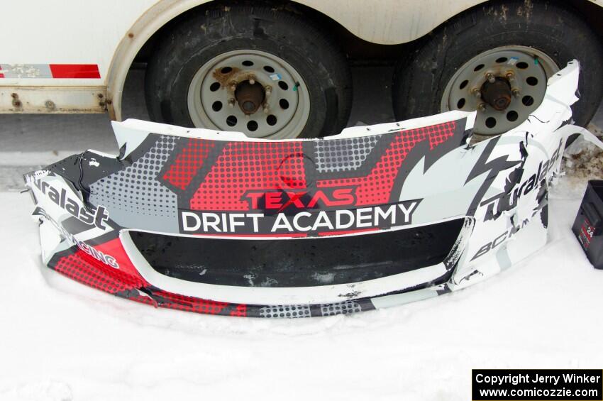 The front bumper of Brent ???'s Nissan 350Z in the paddock after contact.