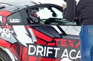 A passenger readies himself in Josh Robinson's Nissan 350Z.