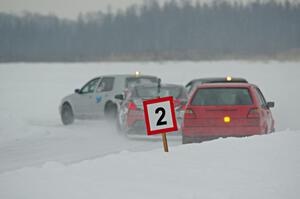 Four cars head into the first corner.