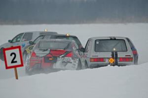 Josh Robinson's Nissan 350Z and Matt Bjorge's VW Rabbit make contact.