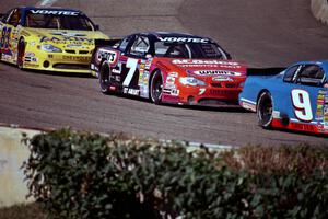 (9) Johnny Sauter's Chevy Monte Carlo, (7) Gary St. Amant's Chevy Monte Carlo and (83) Joey Clanton's Chevy Monte Carlo