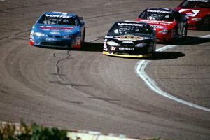 Johnny Sauter's Chevy Monte Carlo and (21) Kevin Cywinski's Chevy Monte Carlo battle